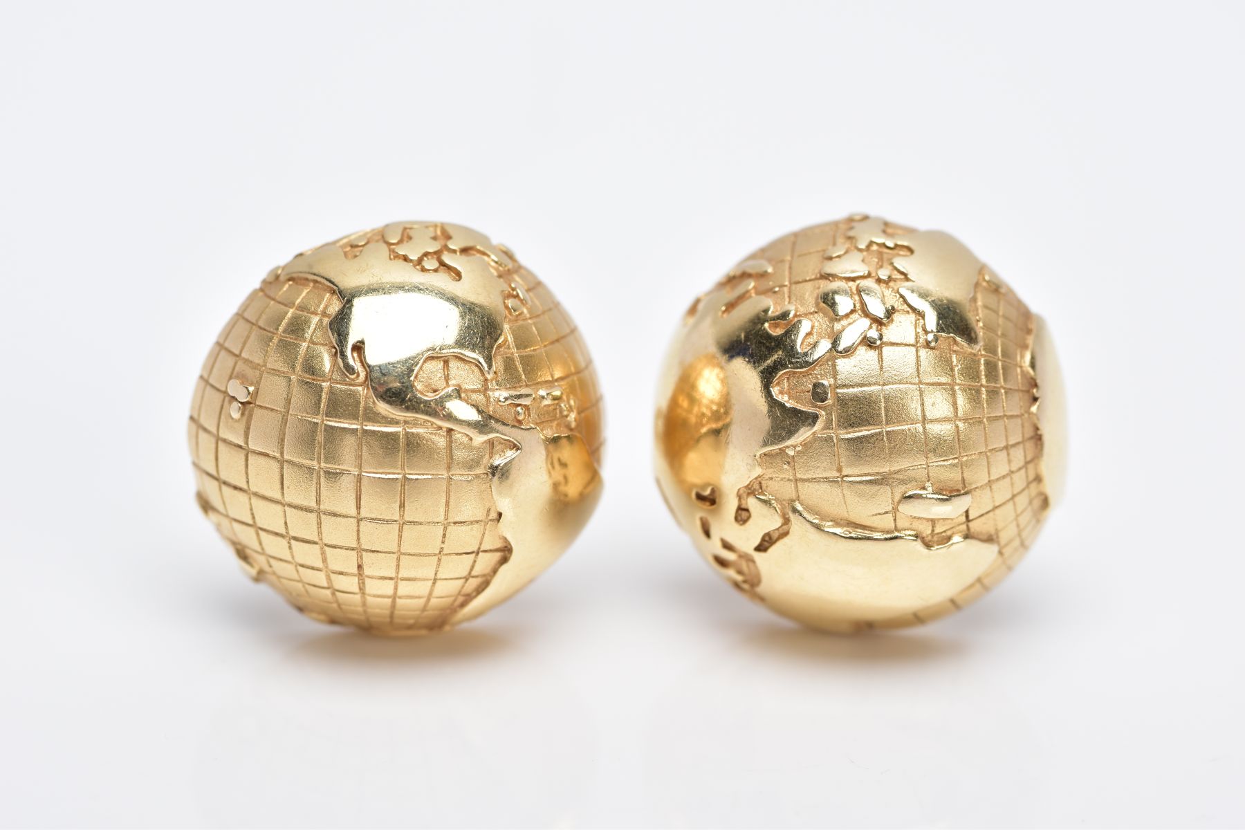 A PAIR OF YELLOW METAL EARRINGS, each of a circular half globe design with post and clip fittings
