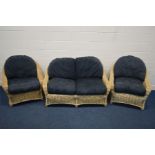 A WICKER THREE PIECE CONSERVATORY SUITE, comprising a two seater settee, width 145cm, and a pair