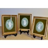 THREE GILT FRAMED AND VELVET MOUNTED WEDGWOOD GREEN JASPERWARE OVAL PLAQUES, each depicting a