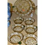 A LATE 19TH CENTURY PALE BROWN AND GREEN GLASS TWIN HANDLED SHALLOW BOWL WITH WHITE LACE DESIGN