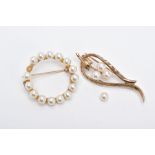 TWO 9CT GOLD CULTURED PEARL SET BROOCHES, the first of an openwork circular form, set with