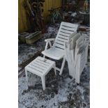 FOUR WHITE PLASTIC FOLDING GARDEN CHAIRS AND A SMALL TABLE and a small quantity of garden tools