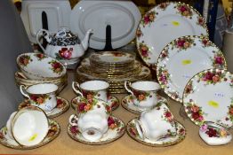 A ROYAL ALBERT OLD COUNTRY ROSES PART DINNER SERVICE AND A ROYAL ALBERT 'SENORITA' PATTERN TEAPOT,