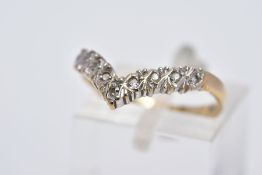 A 9CT GOLD DIAMOND WISHBONE RING, set with a row of single cut diamonds, to a plain polished band,