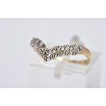 A 9CT GOLD DIAMOND WISHBONE RING, set with a row of single cut diamonds, to a plain polished band,