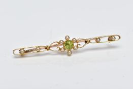 A YELLOW METAL, PERIDOT AND SPLIT PEARL BROOCH, designed with a central circular cut collet set