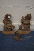 A MATCHED PAIR OF PUNCH AND JUDY CAST IRON DOOR STOPS, along with a cast iron iron (3)