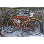 TWO AVENGER GENTS ROAD BIKES, one in red and the other orange