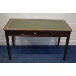 AN EDWARDIAN MAHOGANY WRITING TABLE, with a green leather style top and two frieze drawers, width