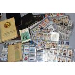EPHEMERA, a collection of over 900 cigarette cards in sleeves and albums, some fairly high 'odds' (