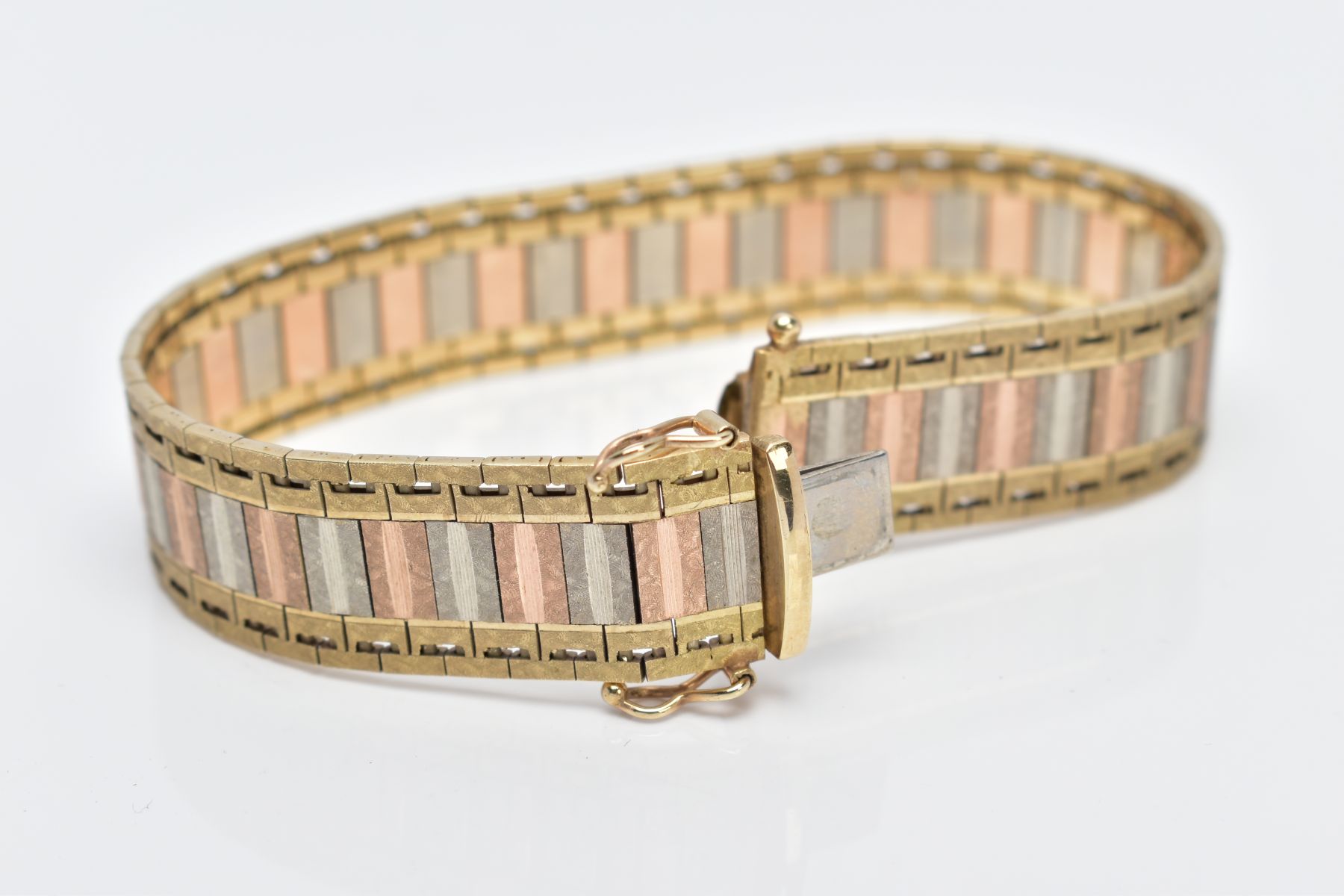 A 9CT TRI-COLOURED GOLD WIDE FLAT LINK BRACELET, designed with textured yellow, rose and white - Image 2 of 5
