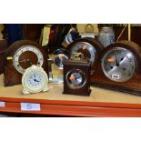 SIX ASSORTED MANTEL CLOCKS AND AN OAK CASED BAROMETER, including three oak cased dome top mantel