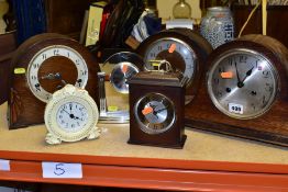 SIX ASSORTED MANTEL CLOCKS AND AN OAK CASED BAROMETER, including three oak cased dome top mantel