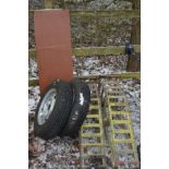 A PAIR OF METAL CAR RAMPS, together with a two 14inch car wheel with tyres, and a wooden shelf (5)
