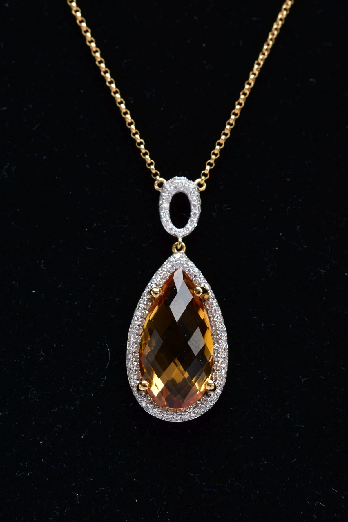 AN 18CT GOLD CITRINE AND DIAMOND PENDANT NECKLET, designed with a claw set pear cut citrine,