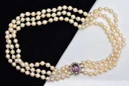 A MULTI STRAND CULTURED PEARL NEACKLACE, designed with three strands of cultured pearls,