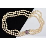 A MULTI STRAND CULTURED PEARL NEACKLACE, designed with three strands of cultured pearls,