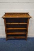 AN EARLY 20TH CENTURY OAK OPEN BOOKCASE, with later adjustable pine shelves, width 107cm x depth
