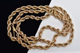 A YELLOW METAL ROPE TWIST CHAIN, fitted with a swivel hook clasp, stamped '9ct', length 680mm,