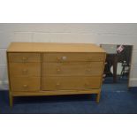 JOHN AND SYLVIA REID FOR STAG, a low oak chest of six drawers, with rounded brass handles, width