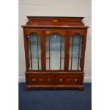 AN EDWARDIAN STYLE MAHOGANY AND BOX STRUNG GLAZED THREE DOOR BOOKCASE, above two deep drawers, width