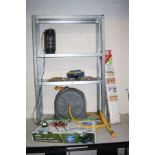 A GALVANISED GARAGE SHELVING UNIT, a hose reel, three locks, a tool caddy, a hose reel cart, and