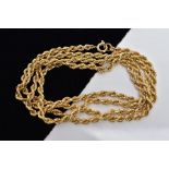 A YELLOW METAL ROPE TWIST CHAIN, fitted with a spring clasp stamped '375', length 700mm, approximate