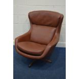 A SCHREIBER BROWN LEATHERETTE SWIVEL CHAIR (repatch leather to back of chair, see image)