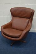 A SCHREIBER BROWN LEATHERETTE SWIVEL CHAIR (repatch leather to back of chair, see image)