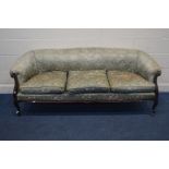 A VICTORIAN MAHOGANY FRAMED THREE SEATER SOFA, covered in green foliate upholstery, width 188cm x
