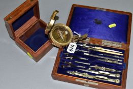 A MODERN BRASS COMPASS, set in a square wooden box, together with a Victorian wooden cased