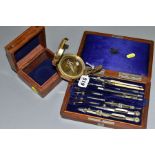 A MODERN BRASS COMPASS, set in a square wooden box, together with a Victorian wooden cased