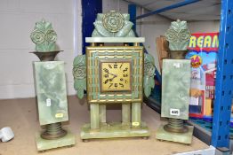 AN ART DECO ONYX AND BRONZED METAL CLOCK GARNITURE, the body supported by onyx columns, the