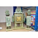 AN ART DECO ONYX AND BRONZED METAL CLOCK GARNITURE, the body supported by onyx columns, the