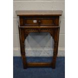 A TITCHMARSH AND GOODWIN OAK CANTED HALL/SIDE TABLE, with a single drawer, on turned and block front