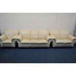 A CREAM LEATHER FOUR PIECE LOUNGE SUITE, comprising a three and a two seater settee, armchair and