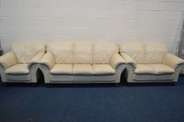 A CREAM LEATHER FOUR PIECE LOUNGE SUITE, comprising a three and a two seater settee, armchair and
