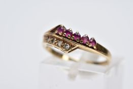 A 9CT GOLD RUBY AND DIAMOND RING,of a crossover design, set with a row of five circular cut rubies