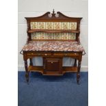 AN EDWARDIAN WALNUT MARBLE TOPPED WASHSTAND, with a floral tile back, two drawers, single cupboard