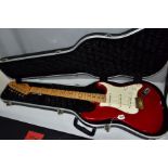 A FENDER STRATOCASTER TYPE GUITAR with a 1960's style neck opaque fender decals to headstock, with