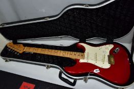 A FENDER STRATOCASTER TYPE GUITAR with a 1960's style neck opaque fender decals to headstock, with