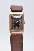 A 9CT GOLD RECTANGULAR CASED WRISTWATCH, black dial with gold coloured Arabic numerals and a