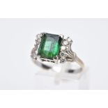 AN 18CT WHITE GOLD GREEN TOURMALINE AND DIAMOND RING, designed with a central, rectangular cut green