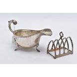 A SILVER SAUCE BOAT AND TOAST RACK, the Georgian sauce boat of a plain polished design, scallop