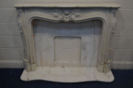 A CREAM RESIN/MARBLE FIRE SUROUND with foliate decoration, width 154cm x height 110cm with similar