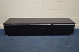 A MODERN BLACK FINISH TV STAND, with two deep drawer flanking a fall front door, width 180cm x depth