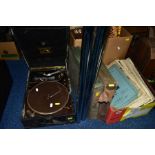 A CASED HIS MASTERS VOICE TABLE TOP GRAMAPHONE in black case along with two folders of 78's, a