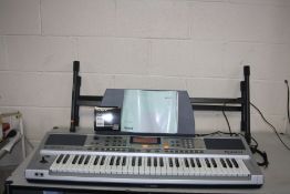 A ROLAND E-200 INTELLIGENT KEYBOARD with manual, dp-2 footswitch, box and stand (PAT pass and all