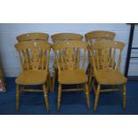 A SET OF SIX BEECH KITCHEN CHAIRS and a circular pine pedestal table (7)