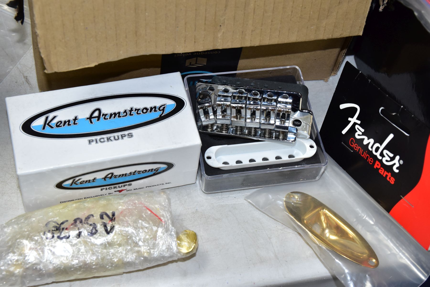 THREE TRAYS CONTAINING GUITAR PARTS, including a 1980 Strat tremolo, 3 scratchplates, a packaged - Image 2 of 6